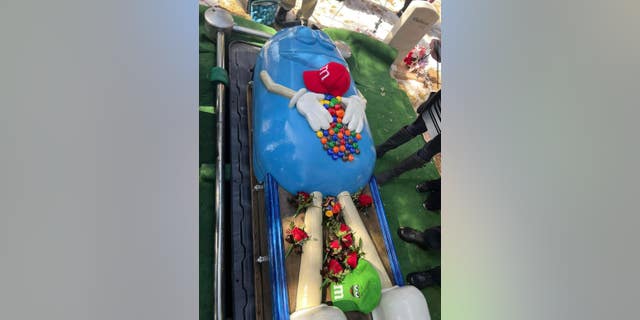 Mary Stocks Martin's M&M-shaped casket featured the names of all her loved ones on miniature-sized candies, which were arranged between the larger M&M character's hands.