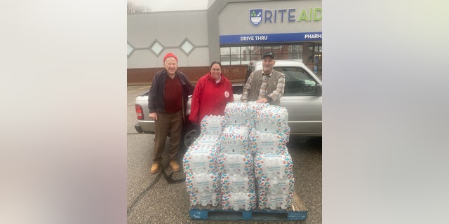 Captain Angelica Spence (center) helps facilitate resource deliveries at a Rite Aid in East Palestine, Ohio.