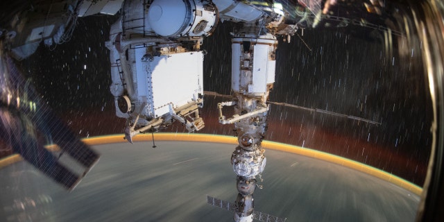 This long-duration photograph shows the Earth 259 miles below a soaring International Space Station. In the foreground, is the Soyuz MS-21 crew ship docked to the Prichal docking module which is itself attached to the Nauka multipurpose laboratory module, Sept. 19, 2022.