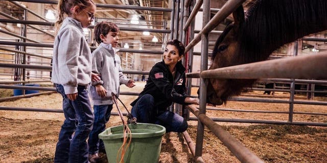 Casey DeSantis and her two children, Madison and Mason, at the Houston Livestock Show and Rodeo on Friday, March 3, 2023.