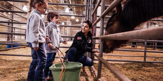 Casey DeSantis and her two children, Madison and Mason at the Houston Livestock Show and Rodeo on Friday, March 3, 2023.