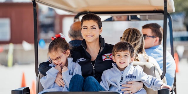 Casey DeSantis (center) and her two children, Madison and Mason, at the Houston Livestock Show and Rodeo on Friday, March 3, 2023.