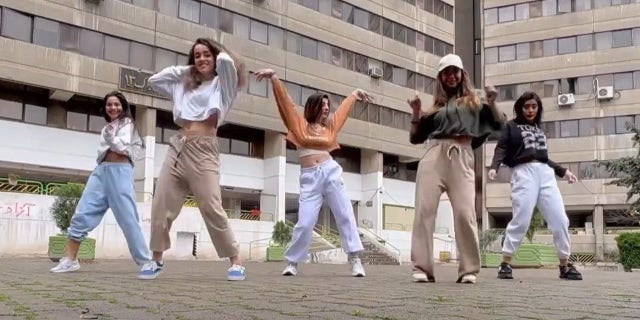 A still image from a social media video depicting five Iranian teen girls dancing to a Selena Gomez song.