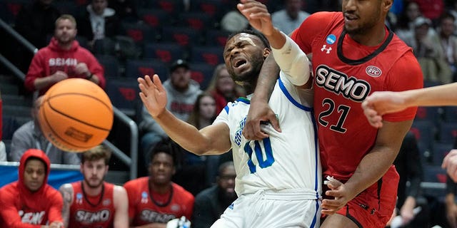 Texas A&amp;M Corpus Christi's Isaac Mushila (10) and Southeast Missouri State's Josh Earley (21) vies for a rebound during the first half of a First Four college basketball game in the NCAA men's basketball tournament, Tuesday, March 14, 2023, in Dayton, Ohio. 