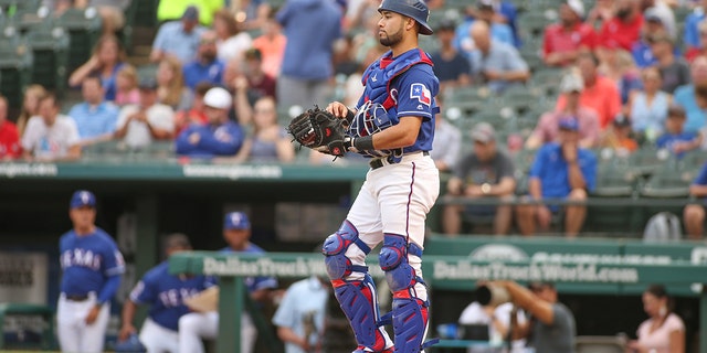 Texas Rangers receiver Isiah Kiner-Falefa looks down the field during a game between the Texas Rangers and the Seattle Mariners on May 20, 2019 at Globe Life Park in Arlington, Texas. 