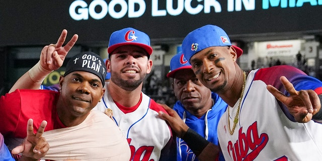 Members of Team Cuba celebrate after winning the WBC quarterfinal game against Team Australia on March 15, 2023 in Tokyo, Japan.
