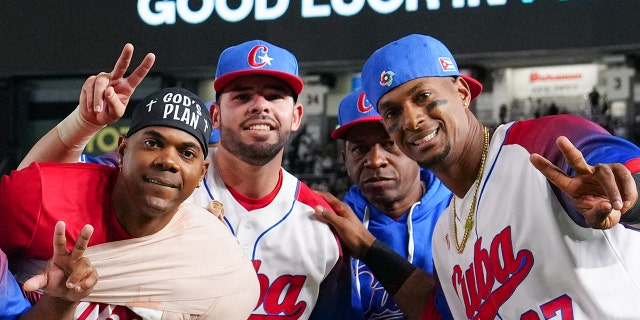 Members of Team Cuba celebrate after winning the WBC quarterfinal game against Team Australia on March 15, 2023 in Tokyo, Japan.