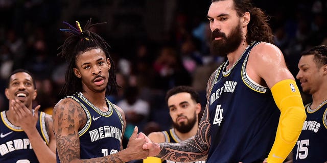 Ja Morant #12 of the Memphis Grizzlies and Steven Adams #4 of the Memphis Grizzlies celebrate together during the game against the San Antonio Spurs at FedExForum on February 28, 2022 in Memphis, Tennessee.