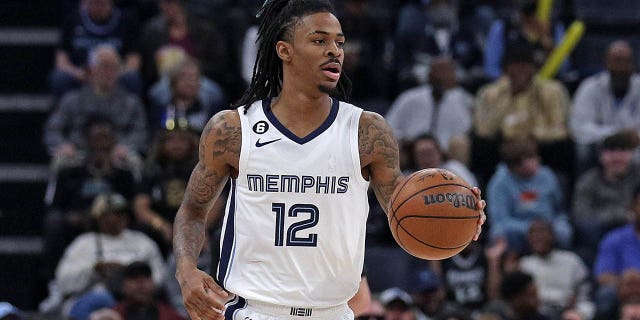 Ja Morant of the Grizzlies brings the ball up court against the New Orleans Pelicans at FedExForum on December 31, 2022 in Memphis, Tennessee.