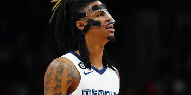 March 3, 2023;  Denver, Colorado, United States;  Memphis Grizzlies guard Ja Morant (12) watches the second quarter against the Denver Nuggets at Ball Arena.