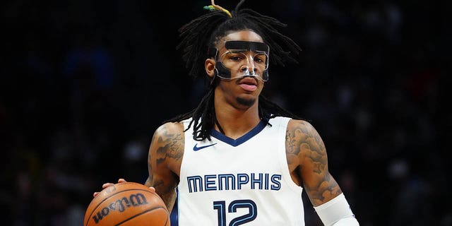 March 3, 2023;  Denver, Colorado, United States;  Memphis Grizzlies guard Ja Morant (12) dribbles during the first quarter against the Denver Nuggets at Ball Arena.