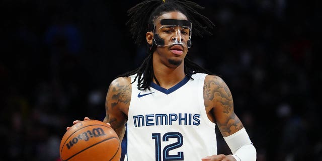 Memphis Grizzlies guard Ja Morant, #12, dribbles during the first quarter against the Denver Nuggets at Ball Arena in Denver on March 3, 2023.