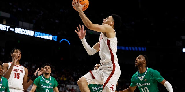 Alabama guard Jahvon Quinerly (5) last in a basket against Texas A&amp;M Corpus Christi in the first half of a first-round college basketball game in the NCAA Tournament in Birmingham, Ala., Thursday, March 16, 2023.