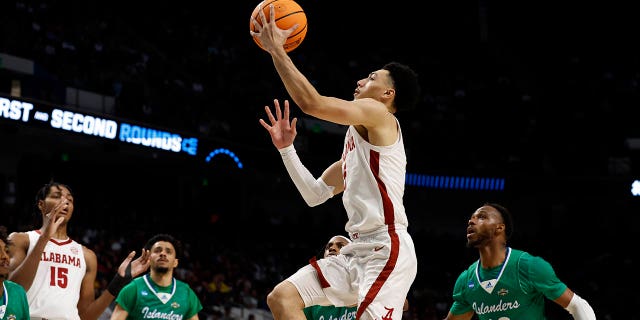Alabama guard Jahvon Quinerly (5) last in a basket against Texas A&M Corpus Christi in the first half of a first-round college basketball game in the NCAA Tournament in Birmingham, Ala., Thursday, March 16, 2023.
