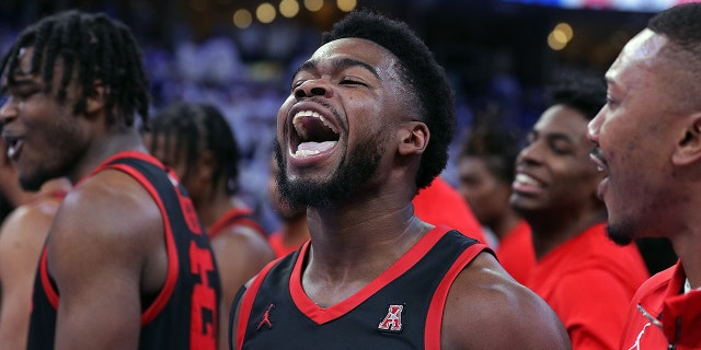 Jamal Shead of the Houston Cougars celebrates after making the game-winning shot against the Memphis Tigers at FedExForum on March 5, 2023.