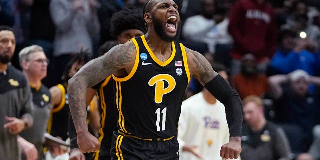 Pittsburgh's Jamarius Burton reacts after hitting the game-winning shot during the second half of a First Four game against Mississippi State in the NCAA men's college basketball tournament Tuesday, March 14, 2023, in Dayton, Ohio.