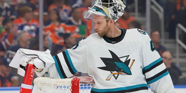 James Reimer, #47 of the San Jose Sharks, gets a drink during the TV timeout in the first period against the Edmonton Oilers on March 20, 2023 at Rogers Place in Edmonton, Alberta, Canada.