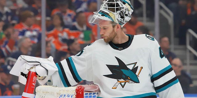 James Reimer, #47 of the San Jose Sharks, gets a drink during the TV timeout in the first period against the Edmonton Oilers on March 20, 2023 at Rogers Place in Edmonton, Alberta, Canada.