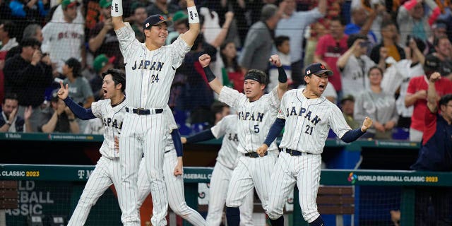 Japan players celebrate after Masataka Yoshida hit a home run scoring Kensuke Kondoh and Shohei Ohtani during the seventh inning of a World Baseball Classic game against Mexico, Monday, March 20, 2023, in Miami.