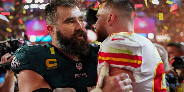 Jason Kelce #62 of the Philadelphia Eagles speaks with Travis Kelce #87 of the Kansas City Chiefs after Super Bowl LVII at State Farm Stadium on February 12, 2023 in Glendale, Arizona.