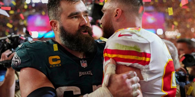 Jason Kelce #62 of the Philadelphia Eagles talks with Travis Kelce #87 of the Kansas City Chiefs after Super Bowl LVII at State Farm Stadium on February 12, 2023 in Glendale, Arizona.