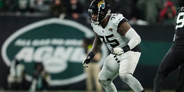 Jawaan Taylor #75 of the Jacksonville Jaguars defends against the New York Jets at MetLife Stadium on December 22, 2022 in East Rutherford, New Jersey.