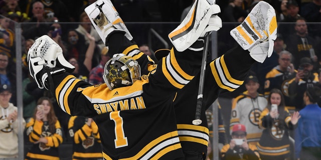 Jeremy Swayman, #1, and Linus Ullmark, #35 of the Boston Bruins, celebrate the win against the Buffalo Sabres at the TD Garden on March 2, 2023 in Boston.
