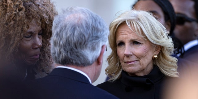First lady Jill Biden listens to Mayor John Cooper during a vigil held for victims of The Covenant School shooting on March 29, 2023, in Nashville.