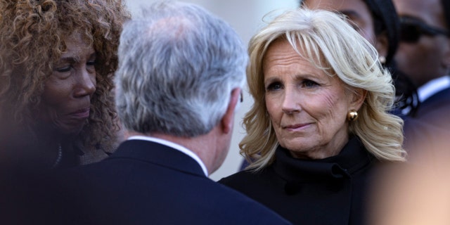 First lady Jill Biden listens to Mayor John Cooper during a vigil held for victims of The Covenant School shooting on March 29, 2023, in Nashville.