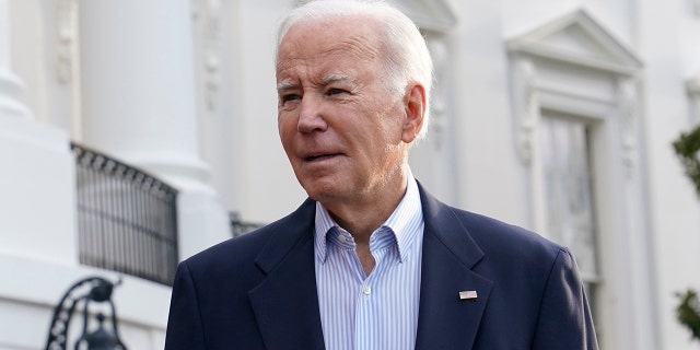 President Biden talks with reporters on the South Lawn of the White House in Washington Friday, March 31, 2023, before boarding Marine One. 