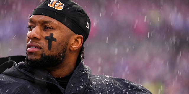 Joe Mixon, #28 of the Cincinnati Bengals, stands during the national anthem against the Buffalo Bills at Highmark Stadium on Jan. 22, 2023 in Orchard Park, New York.