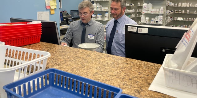 John Seymour, a pharmacist in Virginia, stands with another employee at one of his independent pharmacies. He said he hasn't been able to keep up with the demand for Ozempic. 