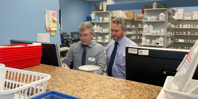 John Seymour, a pharmacist in Virginia, stands with another employee at one of his independent pharmacies. He said he hasn't been able to keep up with the demand for Ozempic.