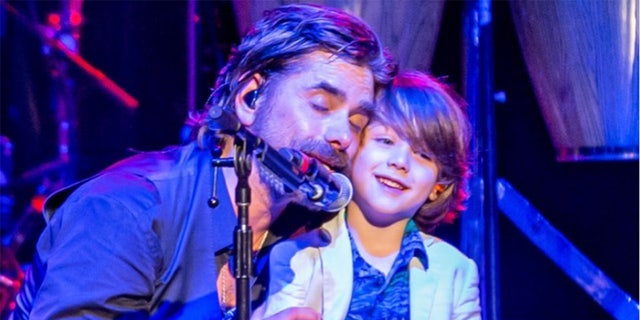 John Stamos brought his son, Billy, onstage to help him during his performance with The Beach Boys.