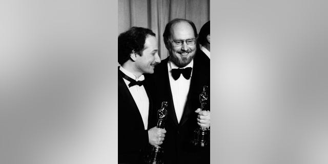 Composer John Williams (right) attends 50th Annual Academy Awards on April 3, 1978 at the Dorothy Chandler Pavilion in Los Angeles, California.