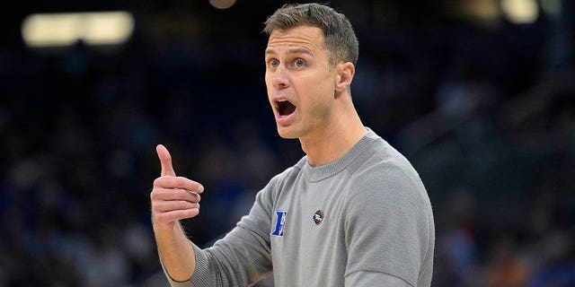 Duke head coach Jon Scheyer calls out instructions during the first half of a first-round college basketball game against Oral Roberts in the NCAA Tournament, Thursday, March 16, 2023, in Orlando, Fla. 