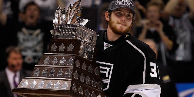 Goalie Jonathan Quick, #32 of the Los Angeles Kings, holds the Conne Smythe Trophy for Most Valuable Player in the NHL Playoffs after the Los Angeles Kings defeated the New Jersey Devils 6-1 in Game Six to win the series 4-2 of the 2012 Stanley Cup Final at Staples Center on June 11, 2012 in Los Angeles.