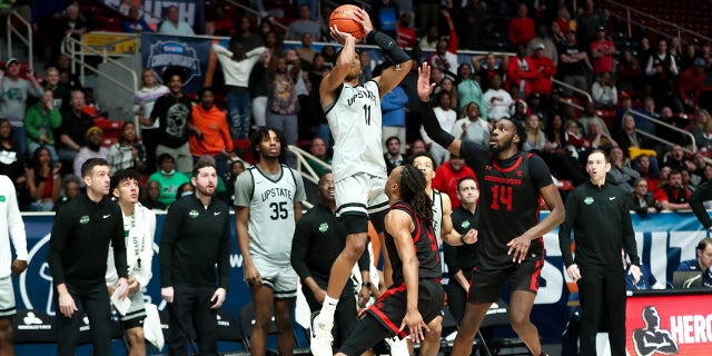 Jordan Gainey (11) of the USC Upstate Spartans shoots the game-winning shot during the Big South Tournament against the Gardner-Webb Runnin' Bulldogs March 3, 2023, at Bojangles Coliseum in Charlotte, N.C.