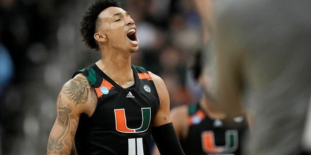 Miami guard Jordan Miller celebrates after scoring against Texas in the second half of an Elite 8 college basketball game at the NCAA Midwest Regional Tournament on Sunday, March 26, 2023, in Kansas City, Missouri. 