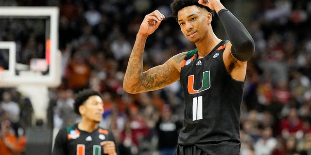 Miami guard Jordan Miller celebrates after scoring against Texas in the second half of an Elite 8 college basketball game at the NCAA Midwest Regional Tournament on Sunday, March 26, 2023, in Kansas City, Missouri. 