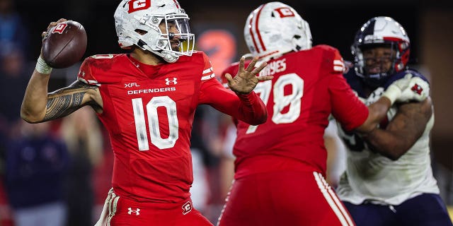 Jordan Ta'amu, #10 of the DC Defenders, attempts a pass against the Houston Roughnecks during the second half of an XFL game at Audi Field on March 27, 2023 in Washington, DC