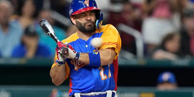 Venezuela's Jose Altuve is hit by a pitch during the fifth inning of a World Baseball Classic game against the U.S., Saturday, March 18, 2023, in Miami.