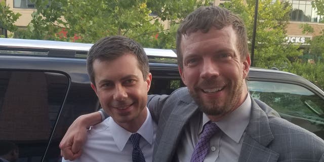 Then-South Bend, Indiana, Mayor Pete Buttigieg, left, with then-College Park, Maryland, Mayor Patrick Wojahn. Wojahn was arrested and charged with 56 child pornography-related counts on Thursday.