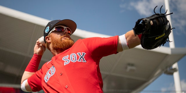 Justin Turner of the Boston Red Sox throws before a Grapefruit League game against the Detroit Tigers on March 6, 2023, at JetBlue Park at Fenway South in Fort Myers, Florida.