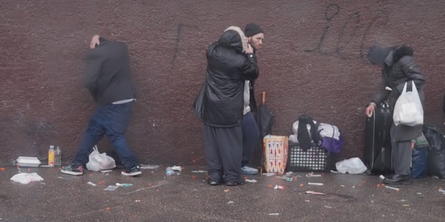 Philadelphia drug addicts line the sidewalk