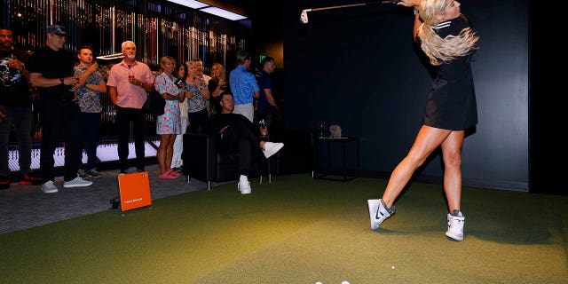 Karen Hart swings a club at the PXG Denver Grand Opening Celebration at PXG Denver on August 25, 2022 in Denver.