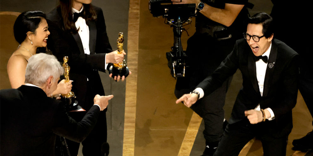 Harrison Ford presented the movie's cast and directors with the Oscar award for Best Picture and embraced Ke Huy Quan when he walked onstage.