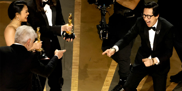 Harrison Ford presented the movie's cast and directors with the Oscar award for Best Picture and embraced Ke Huy Quan when he walked onstage.