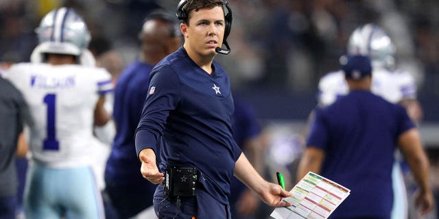 Dallas Cowboys offensive coordinator Kellen Moore is seen during the NFL game between Las Vegas Raiders and Dallas Cowboys at AT&T Stadium on November 25, 2021 in Arlington, Texas.