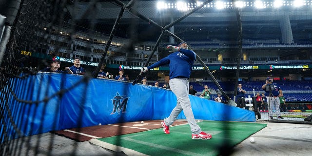 Team USA looks on as hitting coach Ken Griffey Jr. takes batting practice during the Team USA workout prior to the 2023 World Baseball Classic Quarterfinal game between Team Puerto Rico and Team Mexico at loanDepot Park on Friday, March 17, 2023, in Miami, Florida.
